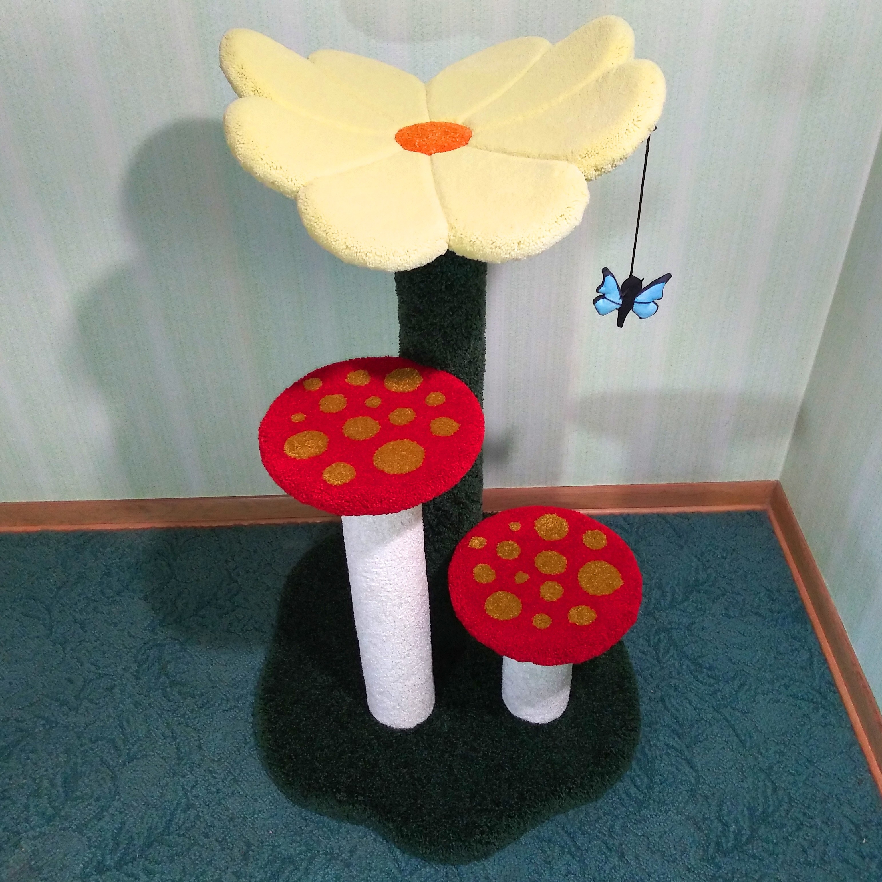 Shown here with pastel yellow flower, forest green base/rear post, white mushroom stems (no sisal), and red mushrooms with gold spots.  Butterfly toy: Copyright CrazyAboutCatnip - https://www.etsy.com/shop/crazyaboutcatnip