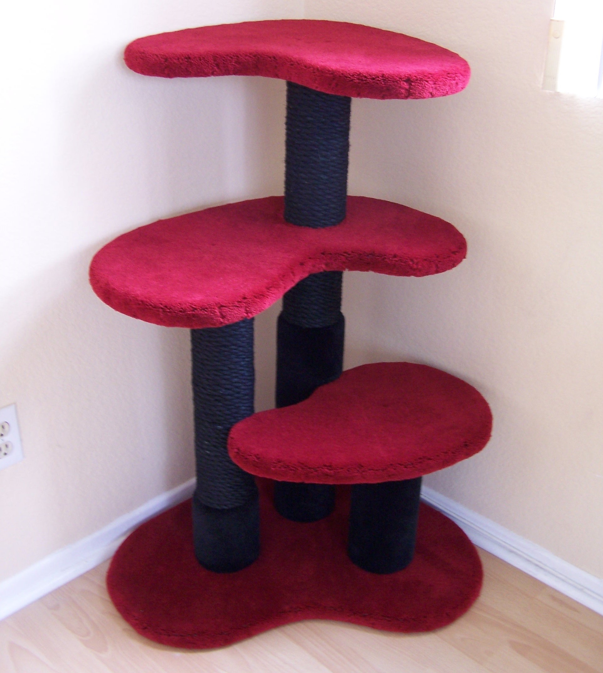 Shown in 42" height with cranberry platforms, black posts, & black dyed sisal.