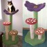 Shown here with purple flower, grass green base/rear post, white mushroom stems (no sisal), and desert red & terra-cotta mushrooms with ivory spots.