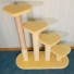 Shown climbing right-to-left in pastel yellow with 1 scratch post in natural sisal