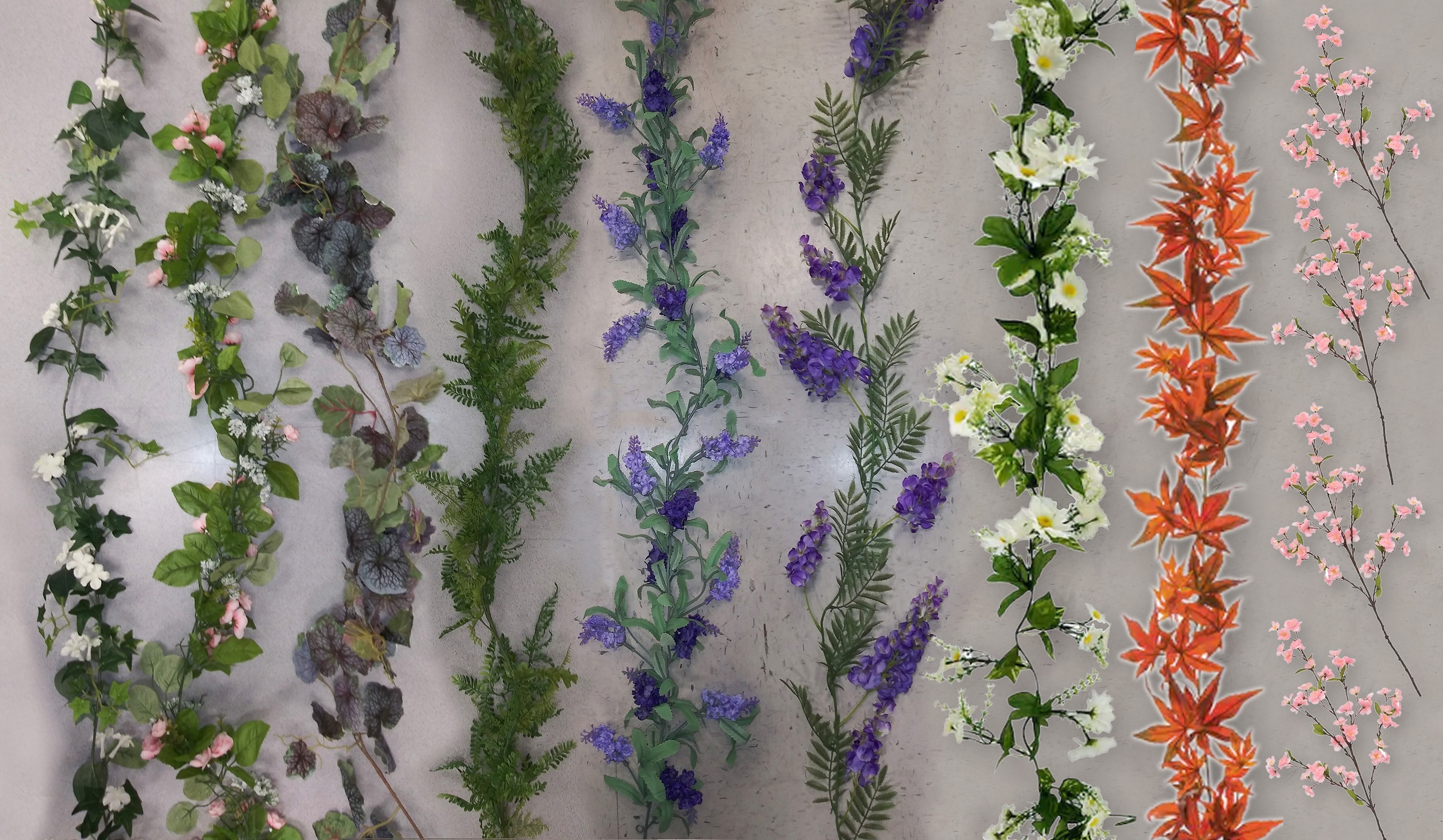 Left to right: English Ivy & Jasmine, Pink Roses & Baby's Breath, Grape Vines, Ferns, Lavender, Wisteria, White Daisies, Japanese Maple, & Cherry Blossoms