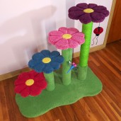 Shown here with grass green base/posts & matching sisal.  Flowers are raspberry, sky blue, carnation pink, and plum. Toys shown are ladybug and dragonfly.