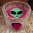 Shown here in terra-cotta, with raspberry background / interior & grass green alien face