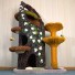 53" height, 16" diameter stump with carpet folds, draping moss, English ivy/jasmine, sparse moss/3 stones, 2 butterflies & 2 toys